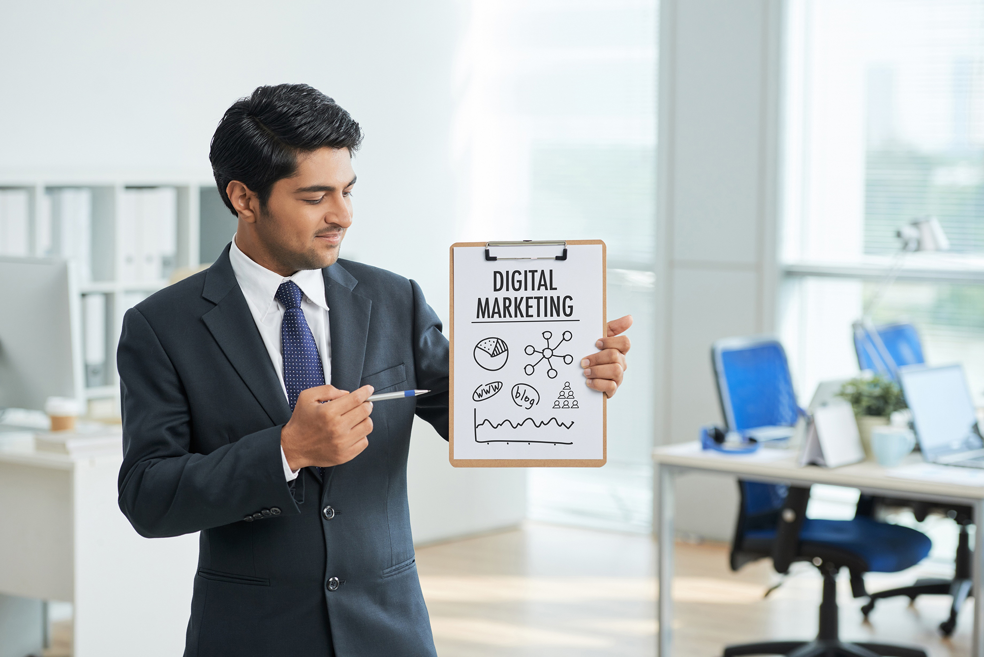 A man holding board with Digital Marketing written on it