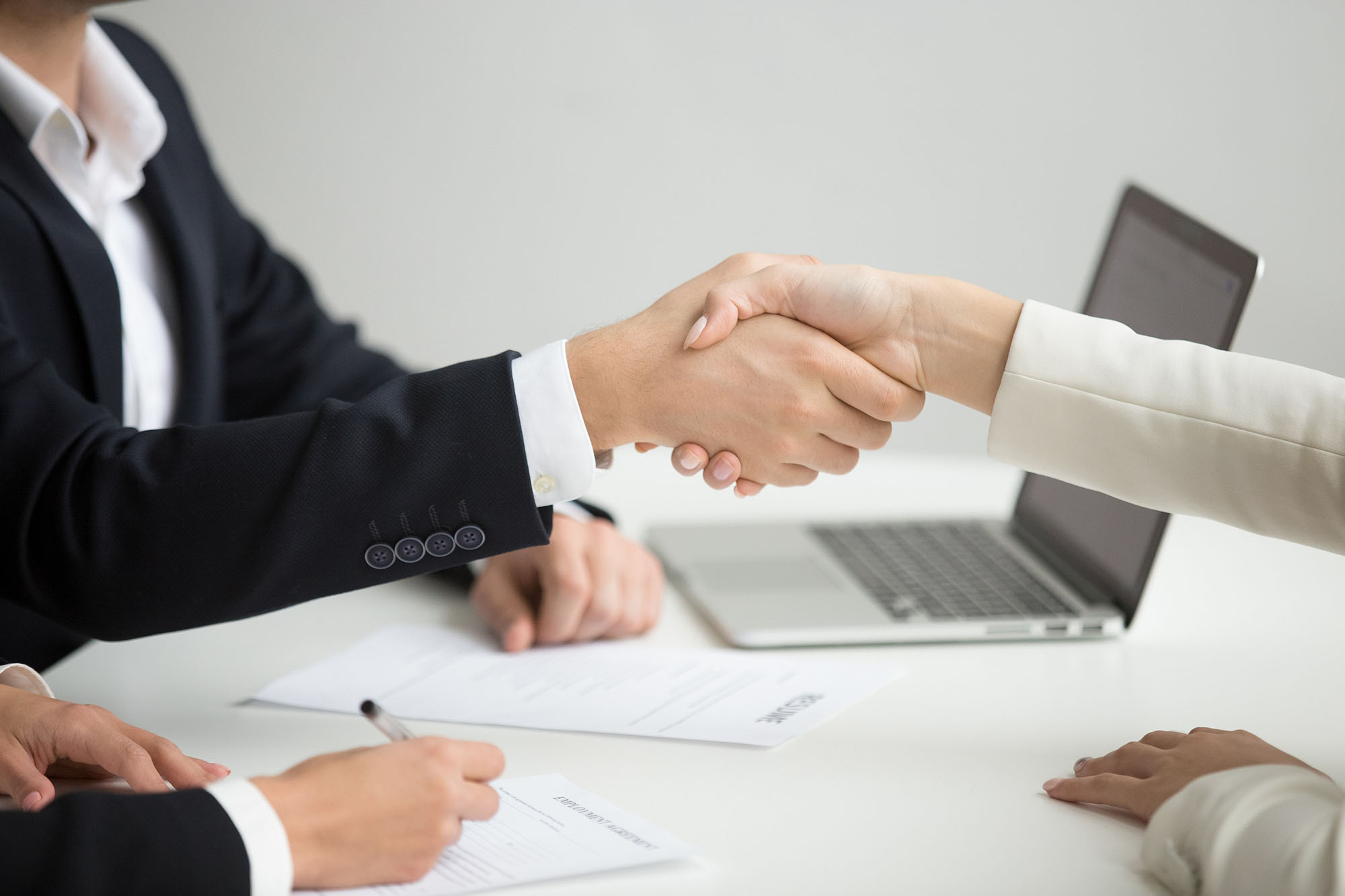 candidate shaking hand with HR consultant