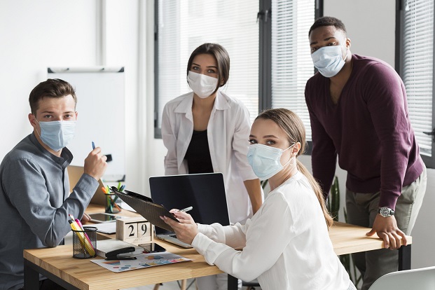 Employees working in office post Covid19 wearing masks
